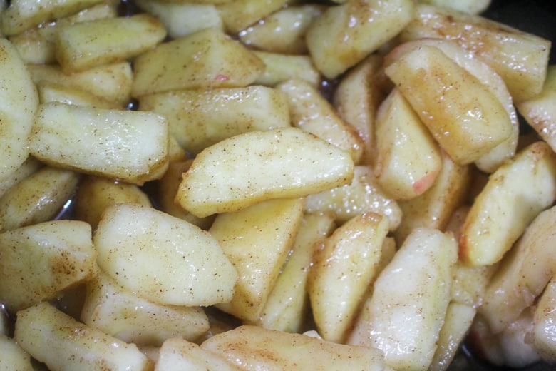 In process image of apples in crockpot