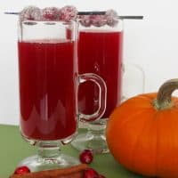 Cranberry apple cider made with sweet tea is an amazing twist on typical hot apple cider, and is easy to make at home in your crockpot or slow cooker.