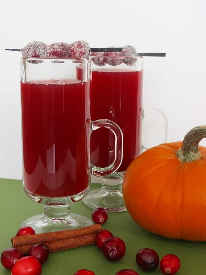 Cranberry apple cider made with sweet tea is an amazing twist on typical hot apple cider, and is easy to make at home in your crockpot or slow cooker.