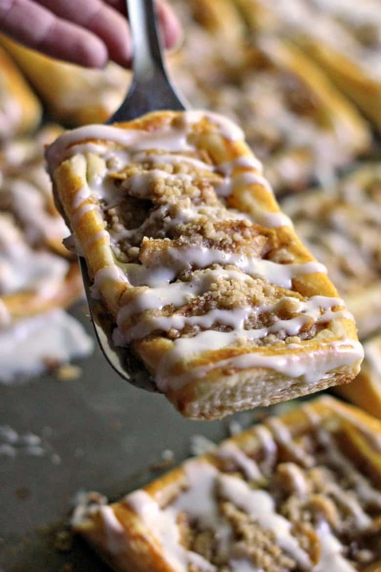 An apple danish recipe with a delicious crumb topping and drizzle of icing. This tasty apple crumb danish makes for a sweet breakfast or brunch option.