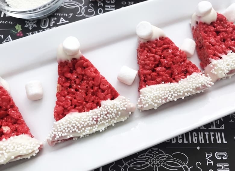 Santa Hat Rice Krispie Treats are easy to make for the kids this Christmas using a traditional Rice Krispies Treat recipe and just adding a few decorations!