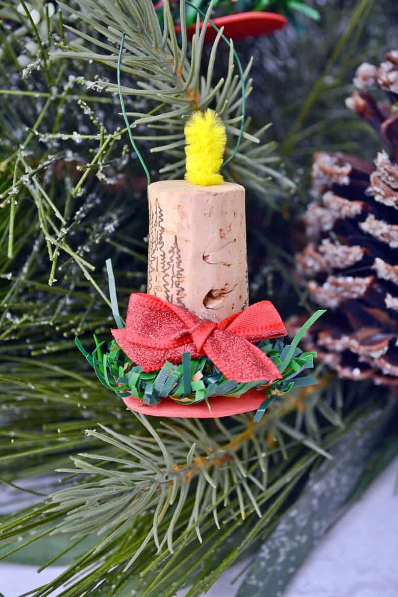 These cute cork candle ornaments are an easy craft project for those looking to add some wine cork Christmas ornament to their trees this year!