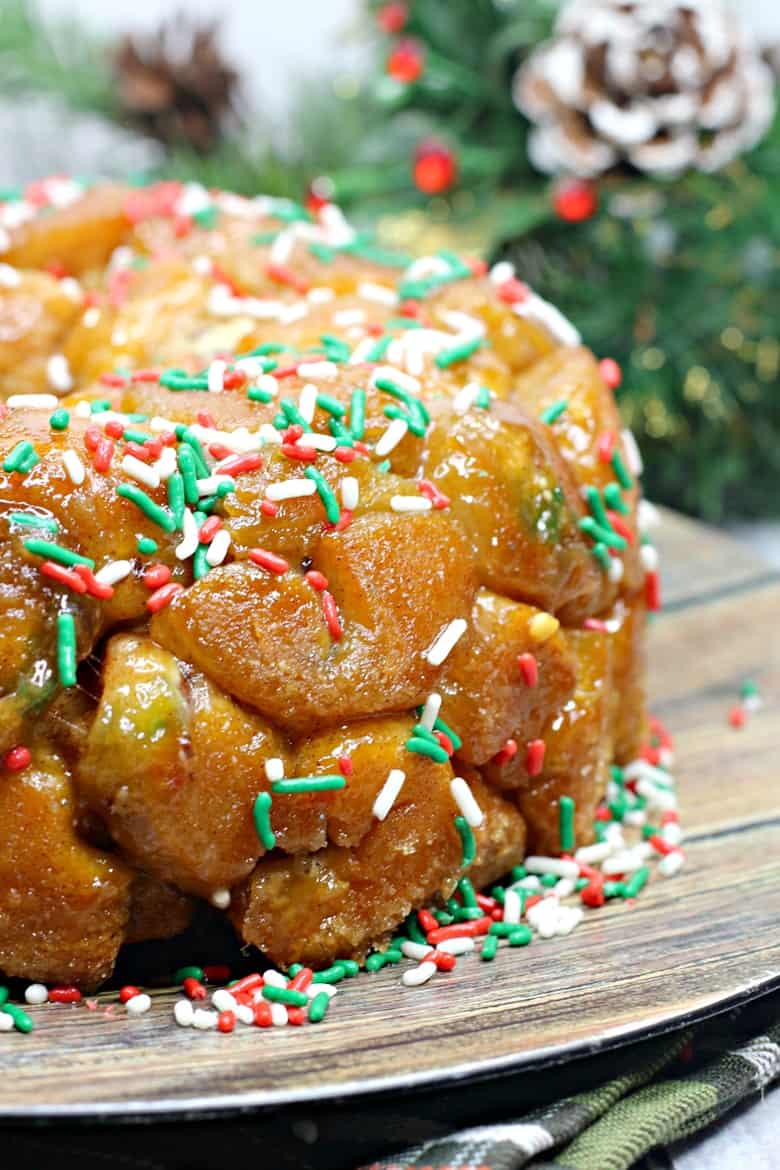 Made using refrigerated biscuit dough, stuffed with chocolate, and covered in holiday sprinkles this easy monkey bread recipe is perfect for Christmas.