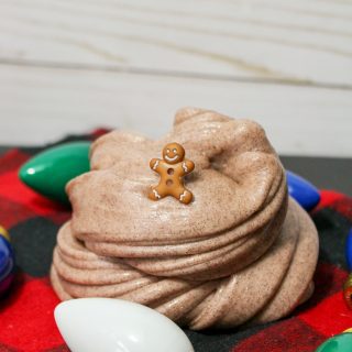 Gingerbread slime with small gingerbread man toy and christmas decor.