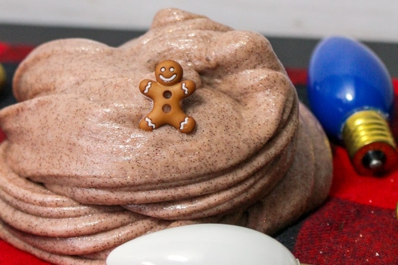 Gingerbread slime with small gingerbread man toy and christmas decor.