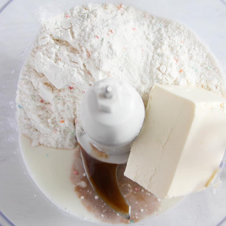 funfetti cake mix, cream cheese, vanilla, and milk to a food processor.