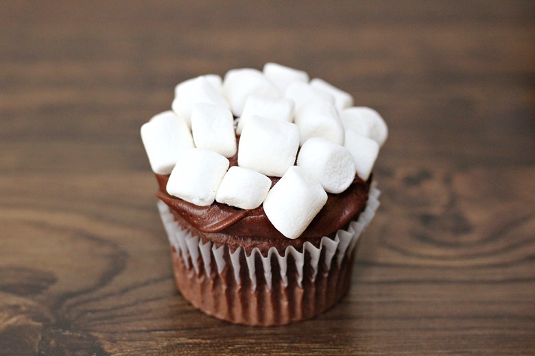 Chocolate cupcake with chocolate fudge icing, and covered in mini marshmallows