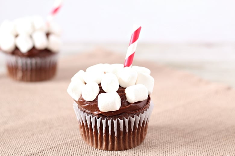 Turn a boxed Devil's Food Cake Mix, store bought icing, and mini marshmallows into fun hot chocolate cupcakes with this easy recipe.