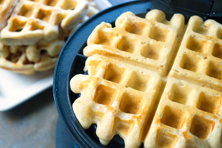 Reese's waffles in waffle iron, cooked to a golden color