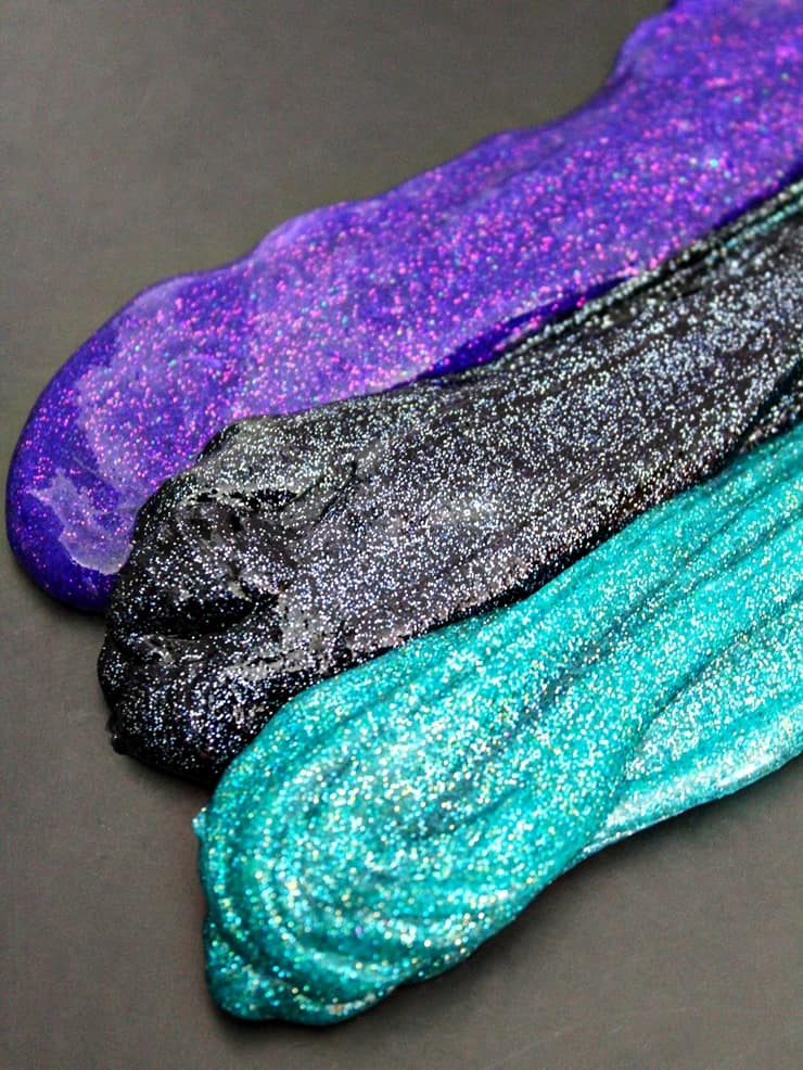 purple, black, and teal glitter slimes