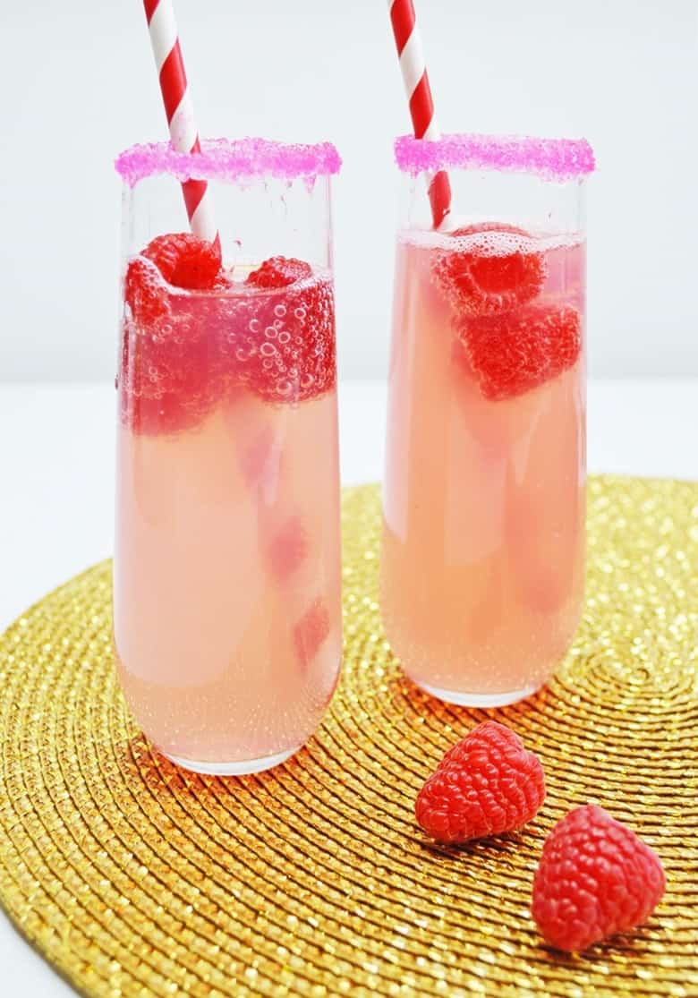 This small-batch Raspberry Lemonade Mimosa recipe made with champagne and raspberry lemonade is a perfect cocktail for brunch with the girls.