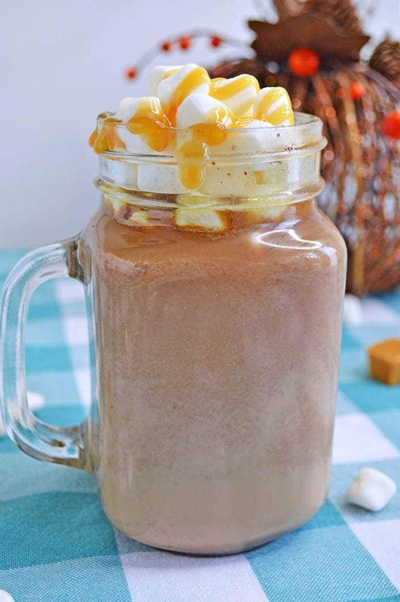 A rich and creamy slow cooker salted caramel hot chocolate recipe that will warm up your bones on those chilly Winter nights.