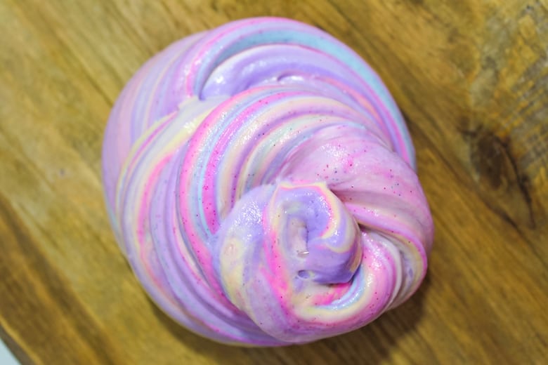 Pink, purple, teal, and yellow unicorn slime