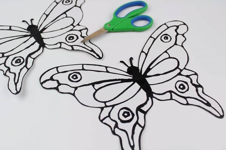 Scissors and butterfly template on white cardstock