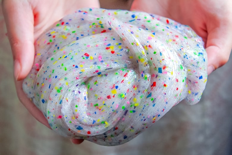 An easy and colorful DIY crayon slime project that helps you use up broken crayons.