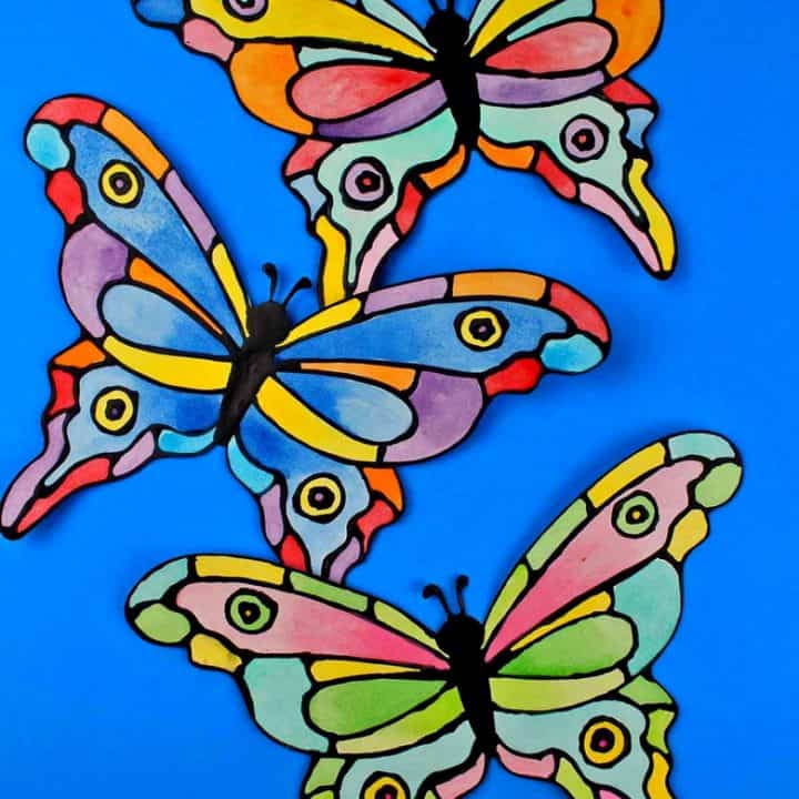 How to make a faux stained-glass butterfly craft using cardstock, glue, watercolors, and the provided printable butterfly template.