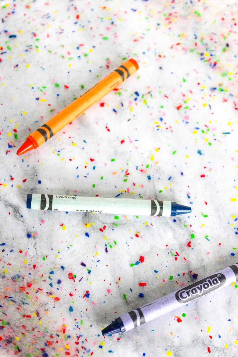 An easy and colorful DIY crayon slime project that helps you use up broken crayons.