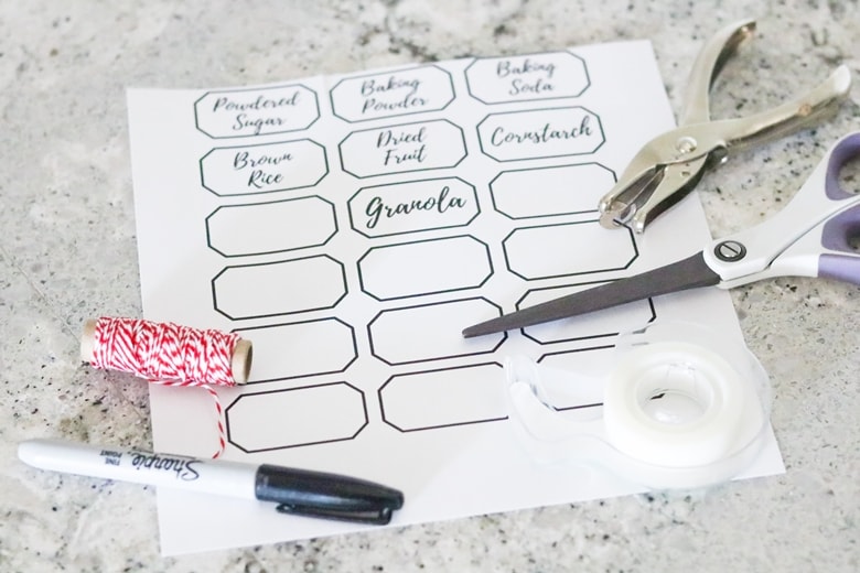 Printable Pantry Organization Labels, scissors, twine, hole punch and marker