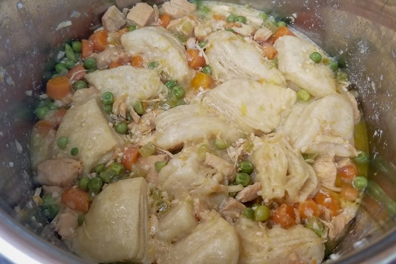 This easy Instant Pot chicken and dumplings recipe is made with canned biscuits and perfect for when you need a bit of comfort food on a busy weeknight.