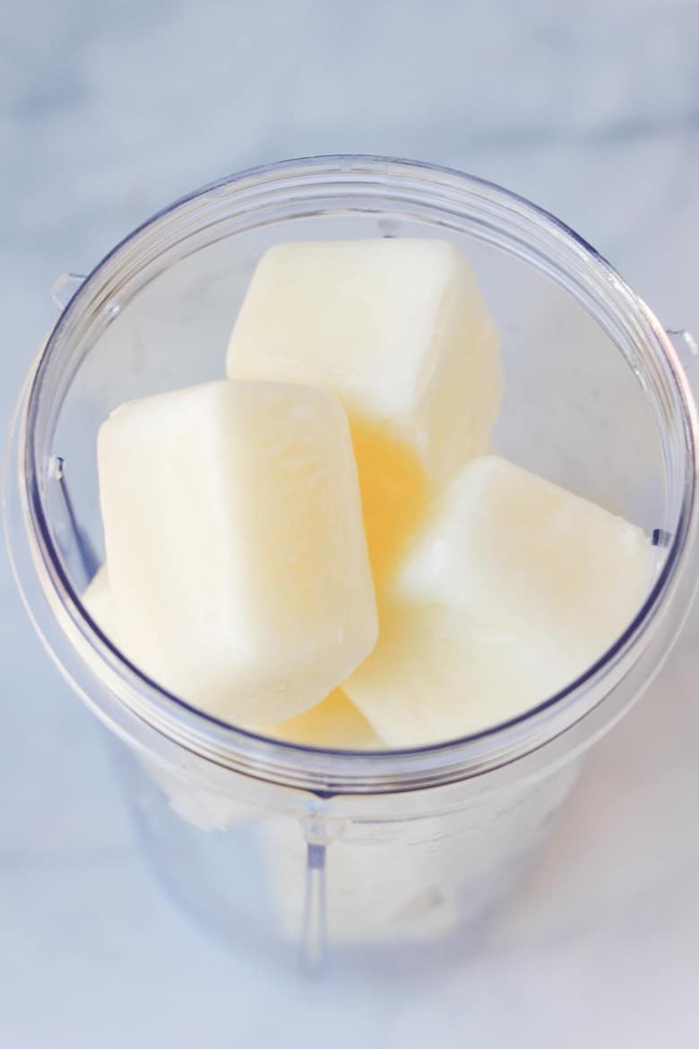 Frozen milk cubes in a Nutribullet blender cup
