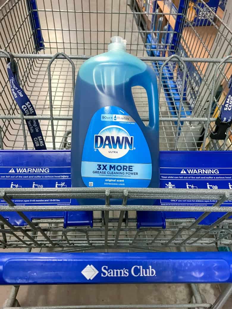 Bottle of 90 oz blue Dawn Ultra in shopping cart that reads "Sam's Club" on handle.