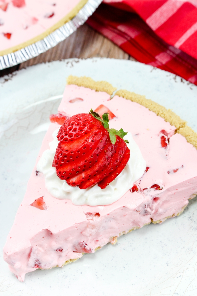 Pink jello pie with strawberries and Cool Whip.