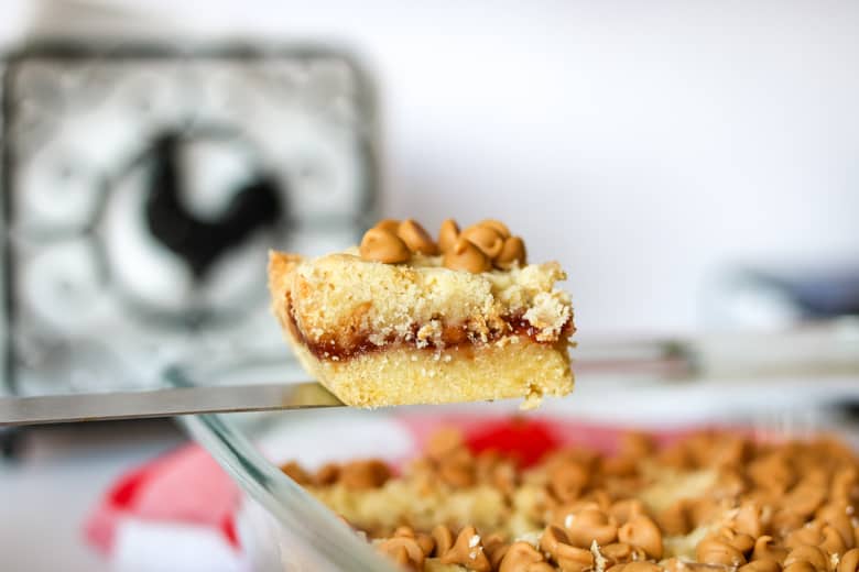 Peanut Butter and Jelly Bar being removed from baking pan