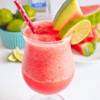 Frozen Watermelon Margarita garnished with watermelon slice and lime slice
