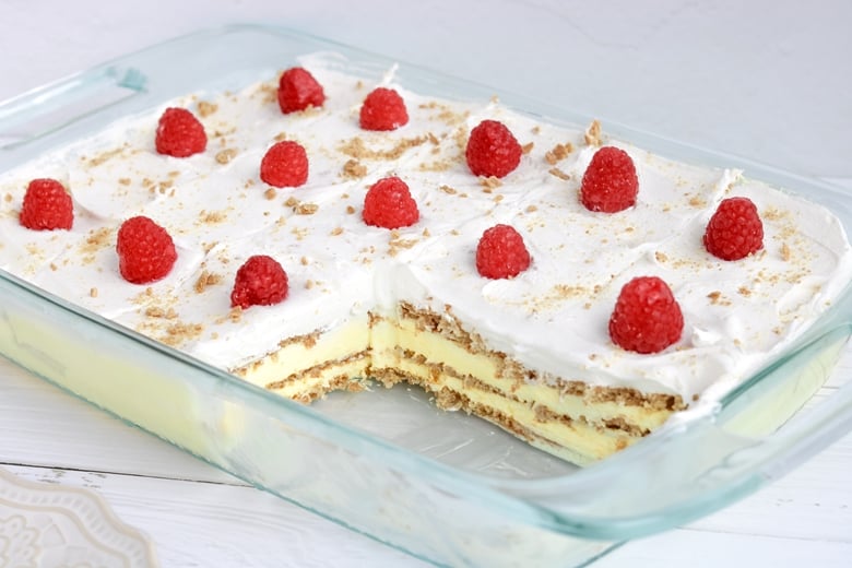 No Bake Lemon Pudding Cake with a few slices removed to show layers