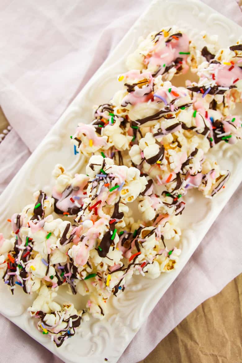 Sundae chocolate covered popcorn with sprinkles