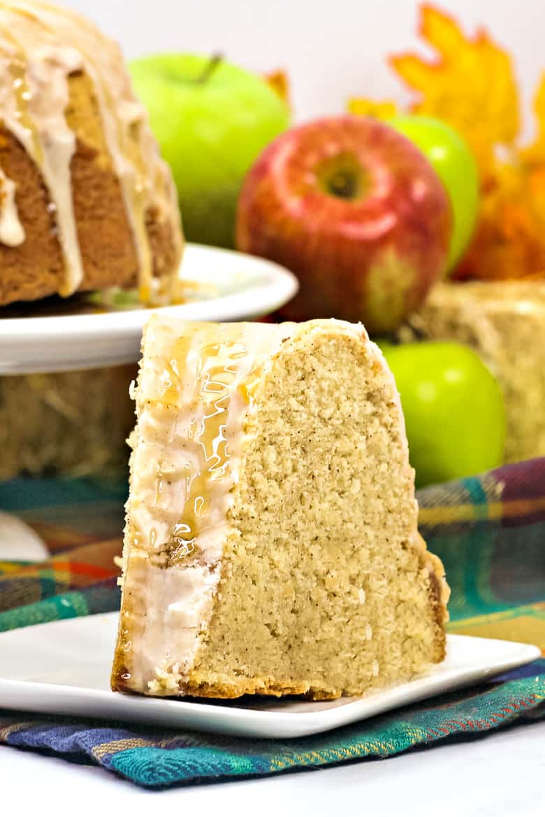 Apple Cider Bundt Cake topped with glazes and drizzle of caramel sauce.