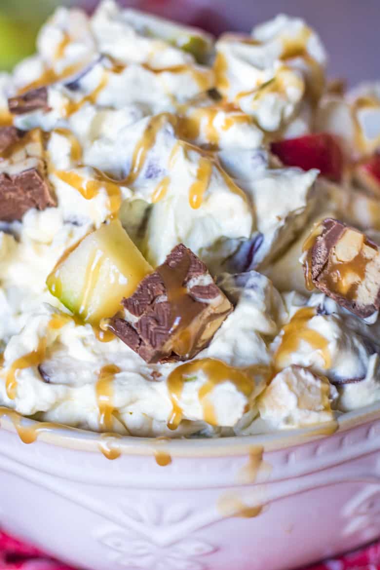 Caramel Apple Dessert Salad with snicker bars and caramel drizzle.