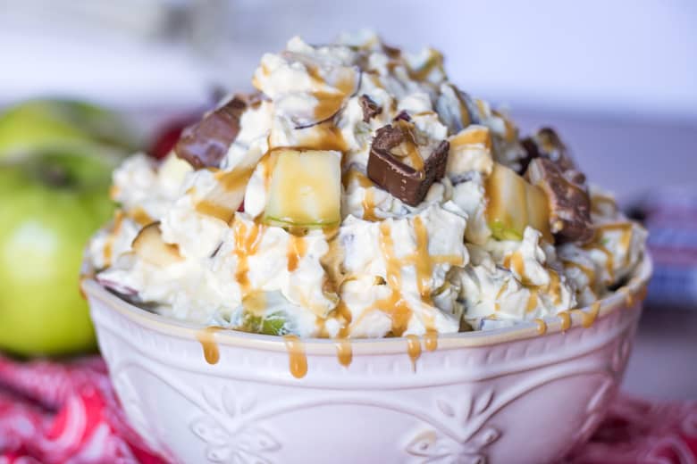 Caramel Apple Snickers Salad served in a bowl.