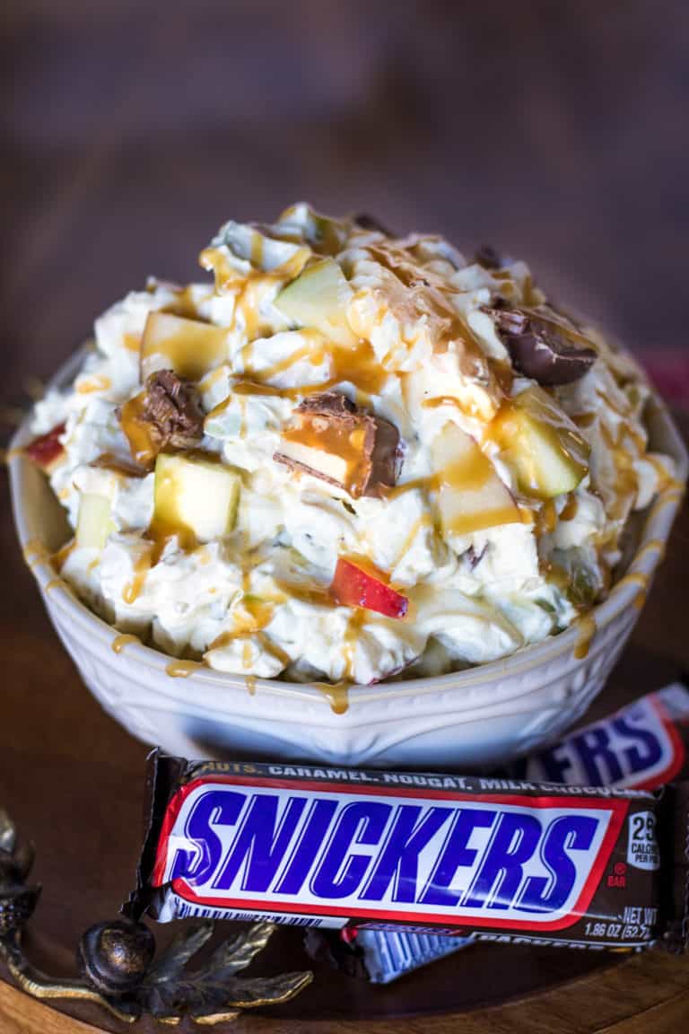 Snickers Salad with Snickers Bars next to the bowl