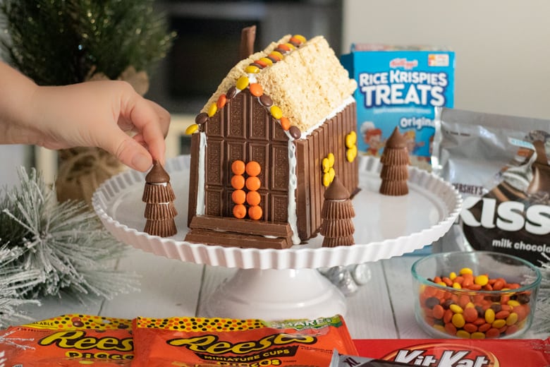 Adding Hershey's Kisses to Top or Reese's Peanut Butter Cup Trees.