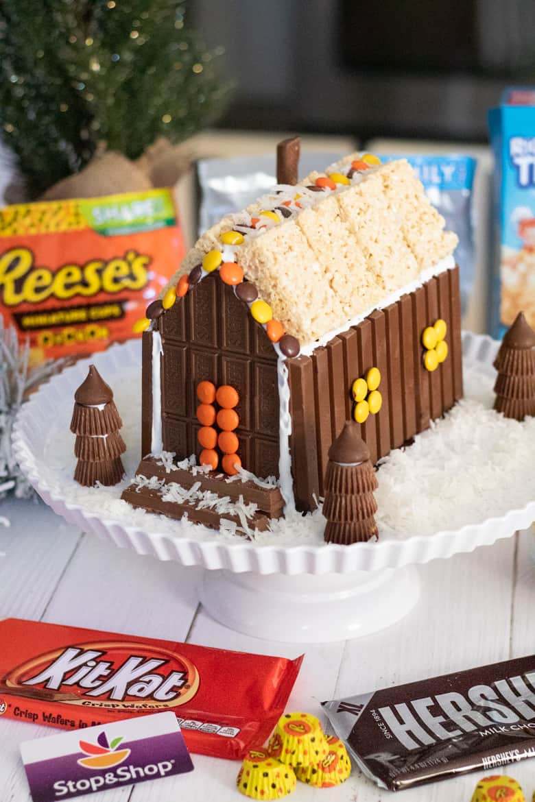 Christmas candy house with KitKat Bar, Hershey's Bar, Reese's Pieces, Reese's Peanut Butter Cups, and Rice Krispies Treats.