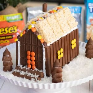 Christmas candy house with KitKat Bar, Hershey's Bar, Reese's Pieces, Reese's Peanut Butter Cups, and Rice Krispies Treats.
