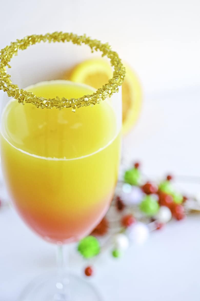 christmas mimosa recipe in champagne glass