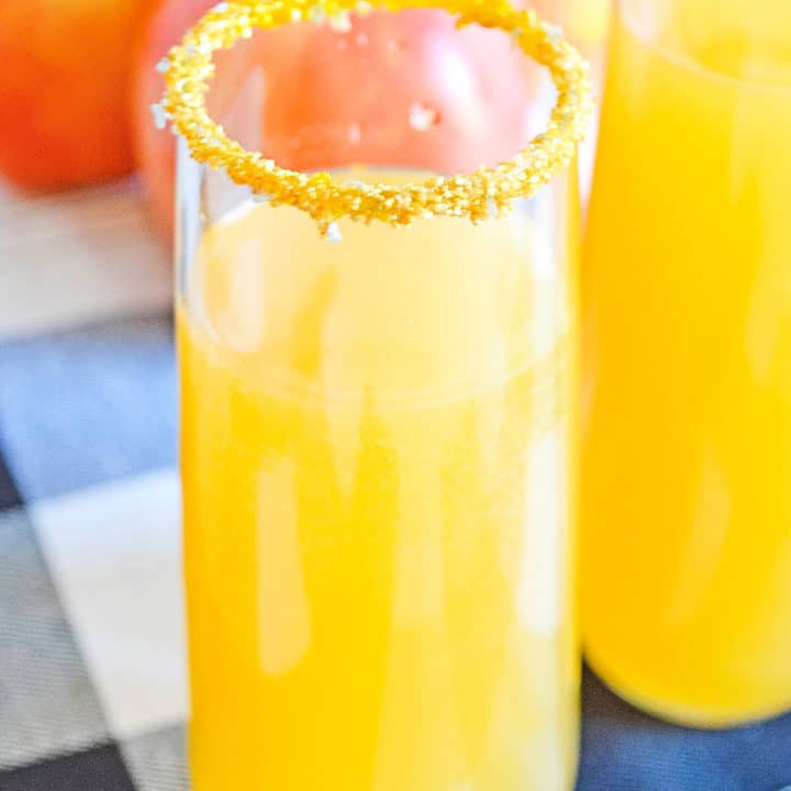 apple cider mimosas sitting on a table