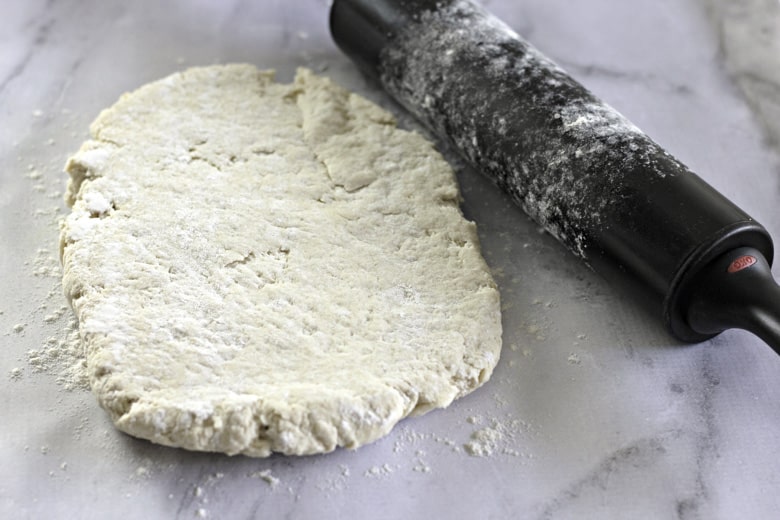 roll out dough for buttermilk biscuits
