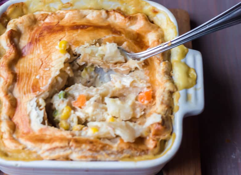 Chicken Pot Pie with crust broken in and filling showing