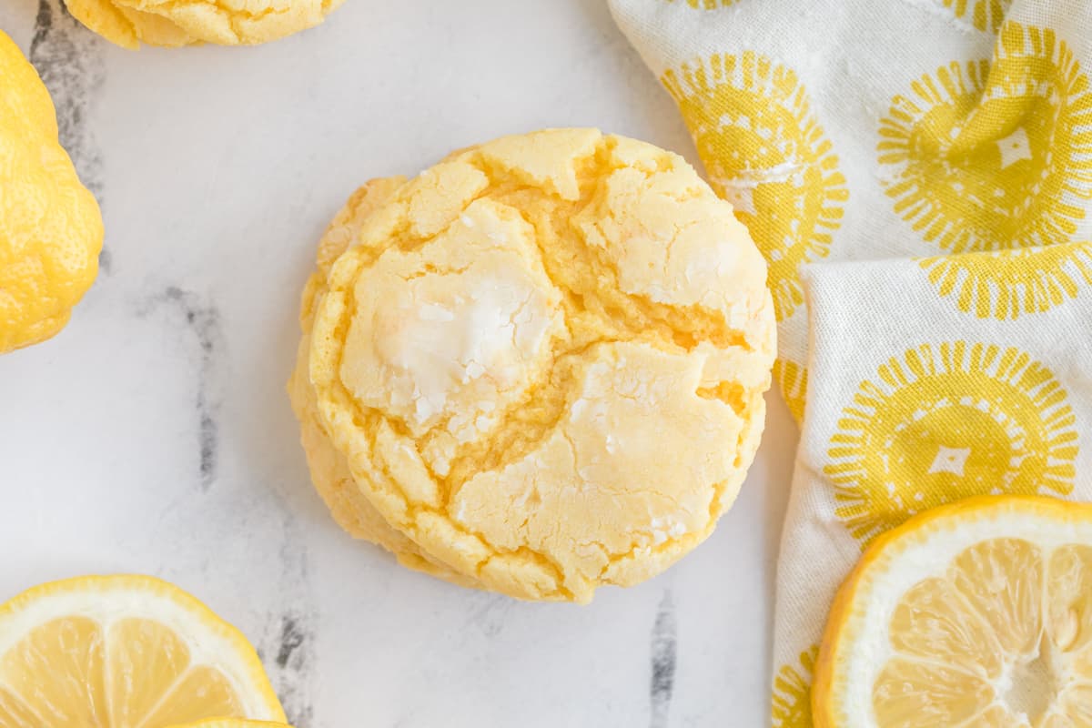 Cake mix lemon cookie with fresh lemons and lemon linen.