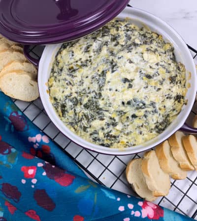 Baked Spinach Artichoke Dip served with sliced bread
