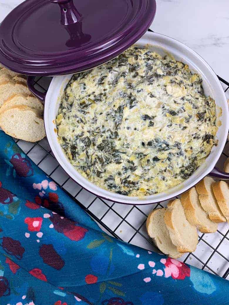Baked Spinach Artichoke Dip served with sliced bread