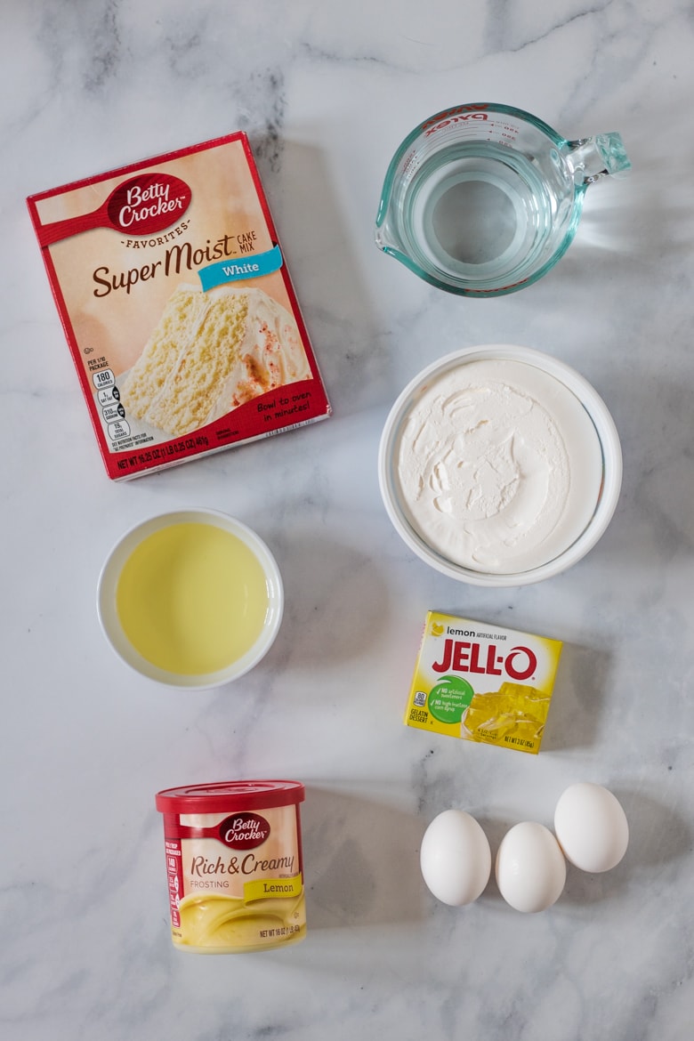 Box of Betty Crocker White Cake Mix, Cool Whip, oil, Lemon Jell-O Mix, Lemon Frosting, and 3 eggs