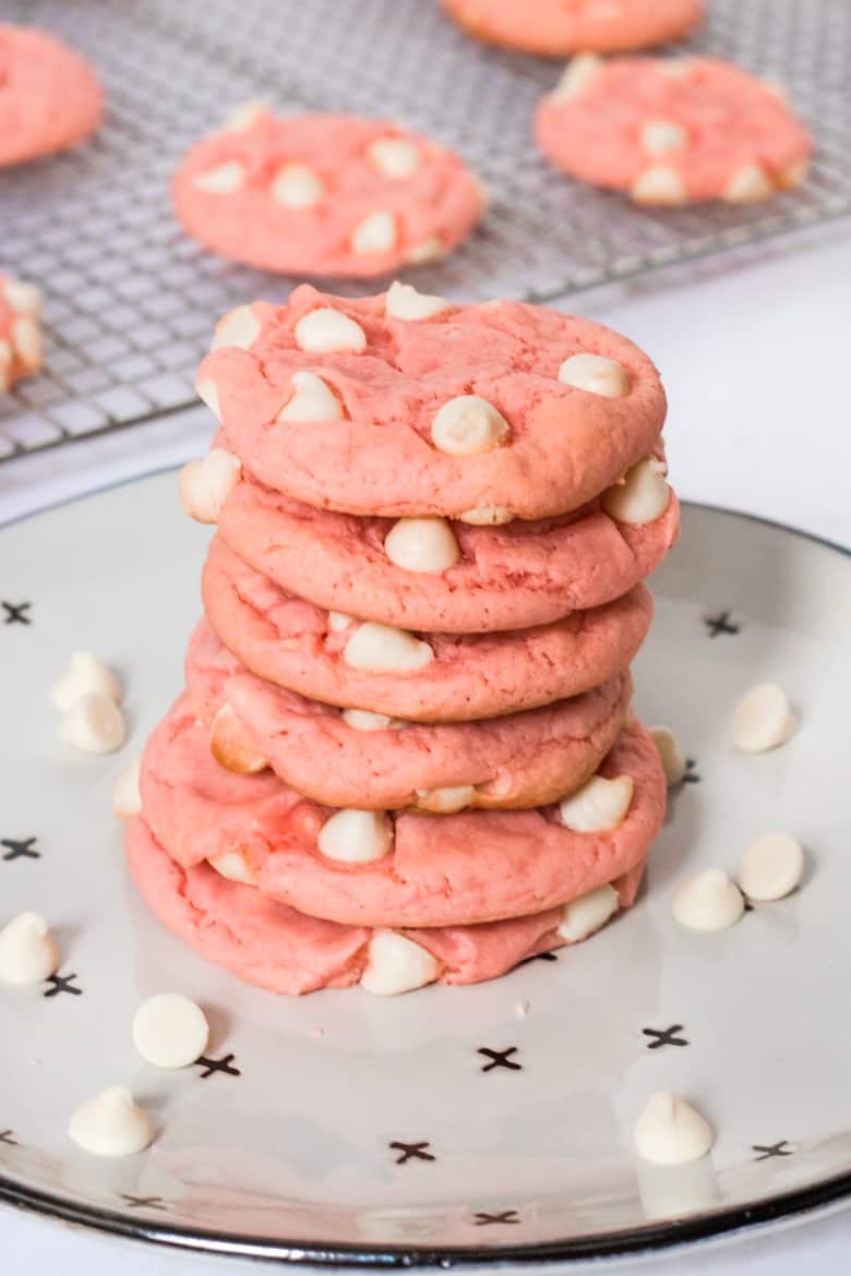 Stacked of strawberry Cake Cookies with white chocolate chips.