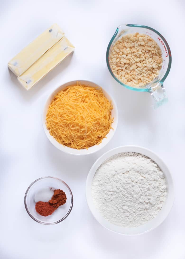 2 sticks butter, shredded cheese, rice cereal, flour, spices