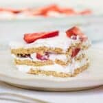 Slice of strawberry and cream layered dessert