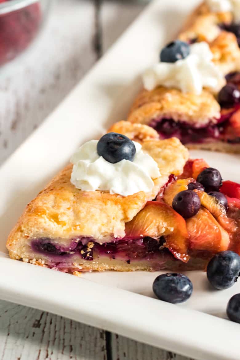 Sliced fruit galette with whipped cream