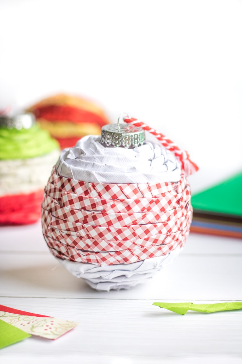 Paper covered plastic ball ornament.